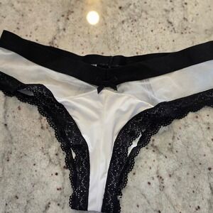 Sheer Victoria's Secret thongs off white and black trim panties womens medium